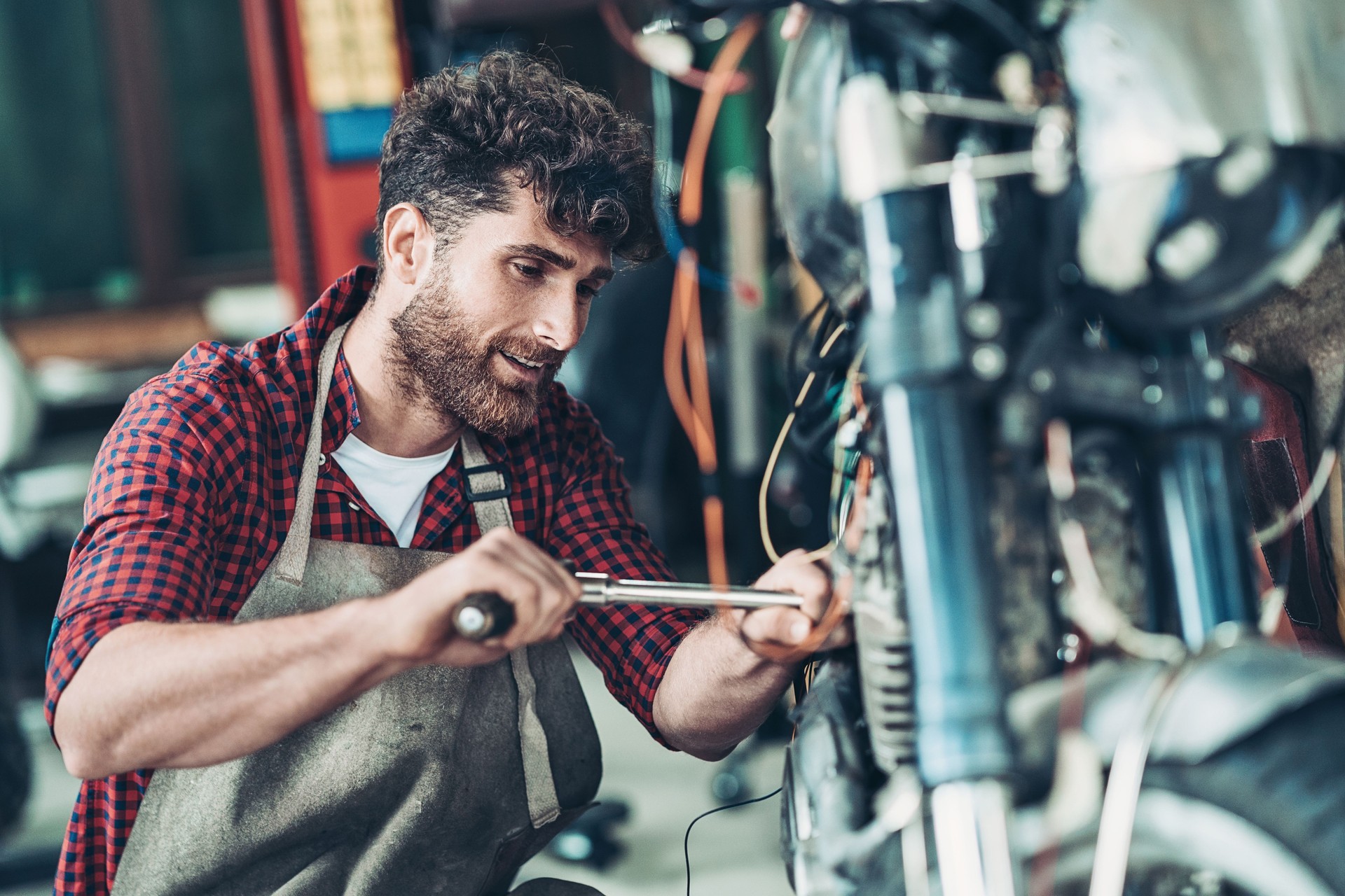 Mechanic building a custom motorcycle
